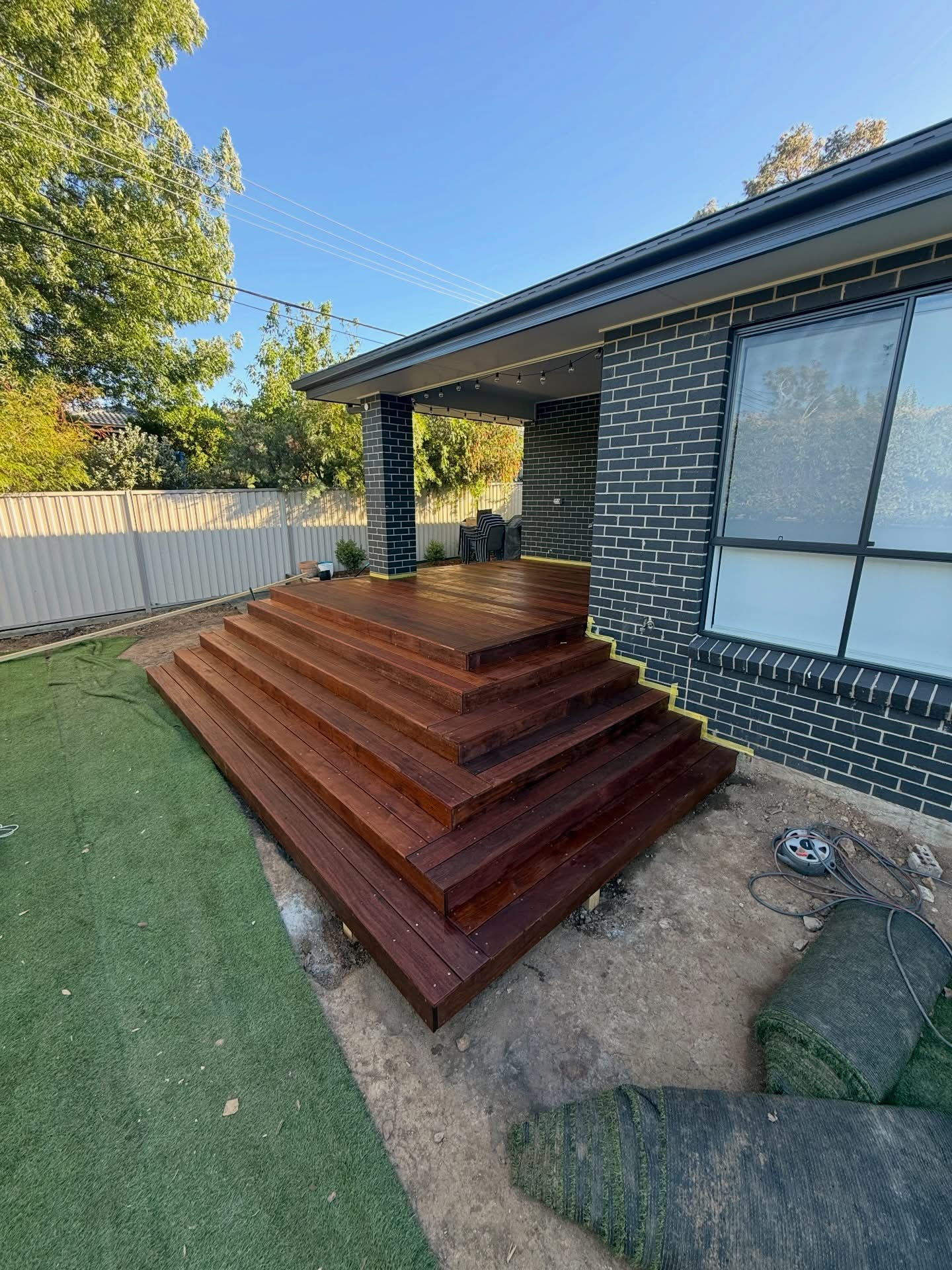 Finished raised timber deck with wide cascading steps