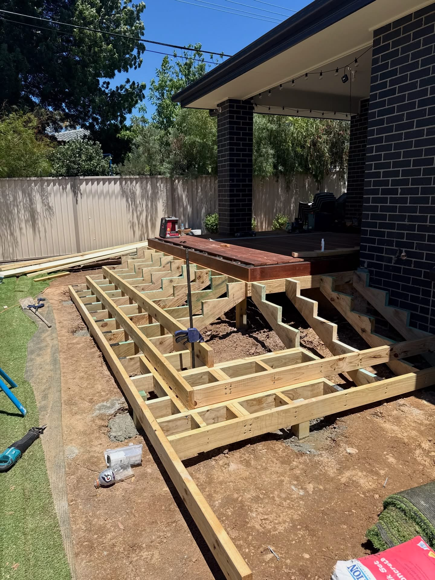 Timber deck framing and stair stringers under construction